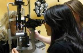 Photo of eye doctor peforming an Eye Exam at Fine Eyewear in the Austin, TX metro